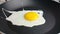 Close-up of fried eggs in the pan, shot in slow motion concept of healthcare and medical