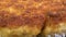 Close-up of fried juicy cutlets in breadcrumbs in a pan. Appetizing food. Bubbles of boiling oil.