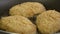 Close-up of fried juicy cutlets in breadcrumbs in a pan. Bubbles of boiling oil.