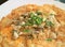 Close-up of fried oysters with crispy omelette topped with chopped spring onion