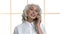 Close up friendly mature woman talking on phone.