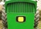 Close-up of front part of a green tractor