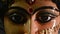 Close up front view face of Goddess Maa Durga Idol. A symbol of strength and power as per Hinduism. Portrait was taken during