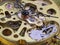 Close up frontside of clockwork mechanism of a golden pocket watch