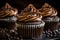 close-up of frosted chocolate cupcake with swirls and mini chocolate chips