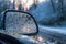 close-up of frozen rain on car side mirror