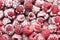 Close up of frozen raspberries as background, fruits texture