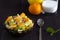 Close-up fruit salad in bowl. Refreshing fruit salad with spoon and lemon