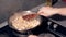 Close up of a frying pan as a chef tosses the pan and stirs a sri lankan chicken curry. indian food.tradition food