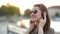 Close Up Funny Portrait Of Young Pretty Girl Listening Music On Big Earphones, Wearing Cute Sunglasses, Posing At City