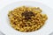 Close-up of Fusilli Lunghi Bucati with bolognese sauce on a plate isolated on white. Traditional italian pasta