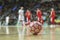 Close up of futsal ball with players in the background