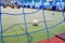 Close-up of futsal mini football goalpost, artificial grass