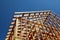 Close-up of gables roof on stick built home under construction and blue sky