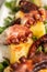 Close-up of Galician Octopus, with potatoes, paprika, olive oil on a rustic granite background. Spanish ethnic cuisine concept