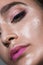 Close up gamour beauty woman portrait. Fashion wet shiny skin, with drops gloss lips make-up and pink eyebrows