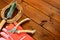 Close-up gardening tools and objects on old wooden background with copyspace