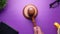 Close up of gavel and book on purple background