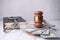 Close up of gavel, cash and handcuff on table