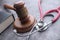 Close up of gavel, stethoscope and book on table