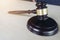 Close up of gavel on wooden table in a courtroom striking, Law a