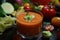 close-up of gazpacho, with ingredients visible and bright