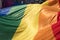 Close up of the giant rainbow LGBT flag at the front of the Gay Pride Parade in London 2018. Flag reflects the sunlight.