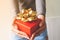 Close up gift box on woman hands. Thanksgiving or Christmas