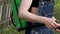 Close-up of girl farmer treats the lawn with fertilizer.