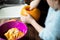 Close Up of Girl Hollowing Out Pumpkin To Make Halloween Lantern