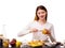 A close-up of a girl with a knife takes out a condensed milk for Belgian waffles with a banana filling.