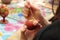 Close up of girl painting Easter eggs