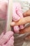 Close-up of girl`s fingers and nails during manicure procedure. Nail sawing with a nail file