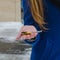 Close-up of girl`s hand with the realtor the keys in the hands