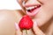 Close up of girl\'s mouth eating strawberry