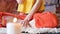 Close-up a girl surrounded by candles at home at the window meditates in the lotus position making fingers mudra next to