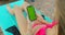 Close up of girl using mobile phone green screen while relaxing near the swimming pool. Hands holding smartphone chrome