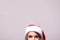 Close up girls eyes in Christmas Santa hat