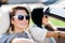 Close up of girls in sunglasses in the convertible car
