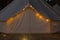 Close-up of glamping bell tent at night