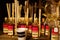 Close up of glass bottles with perfume scent of vanilla and fragrance Perfusor sticks in shelf inside French shop