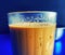 Close up of glass of chai tea over blue background created using generative ai technology