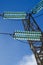 Close-up of glass electrical insulators for high voltage standing out in a blue sky