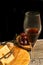 Close up of glass of french wine with bowl of grapes and a cheese plate