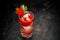 Close up a glass of fresh Strawberry Cocktail mojito soda on dark background, copy space