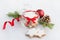 Close up of a glass jar full with christmas homemade star cookies over white fluffy background. Christmas decoration.