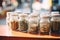 close-up of glass jars filled with various strains of cannabis