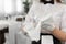 Close-up of a glass and a towel in the hands of a waiter. Preparation, table setting