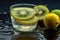 close-up of glass of water with slices of lemon and kiwi floating on the surface