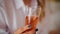 Close-up of a glass of wine in the hands of a girl.